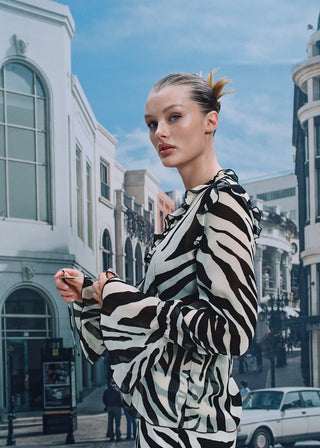Blusa con Volantes Estampado Animal Print