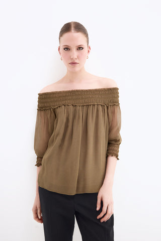 E. Blusa Off Shoulder Goma.