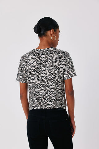 2.T.B. Camiseta Básica Botones.