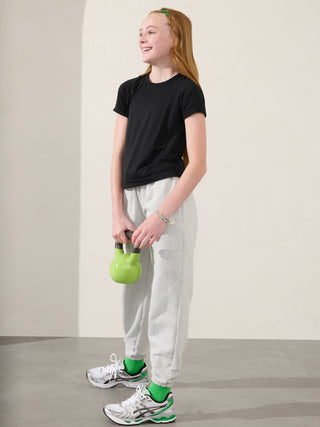 Camiseta larga deportiva Power Up para niña Athleta.