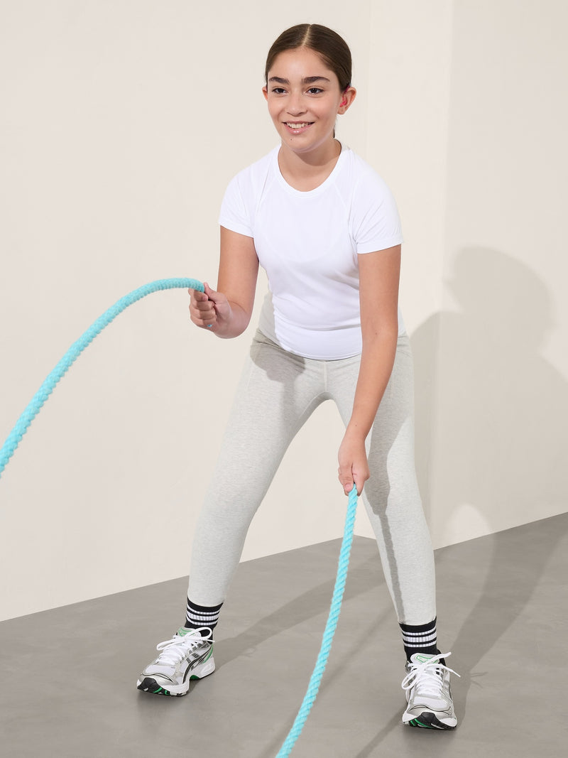 Camiseta larga deportiva Power Up para niña Athleta.