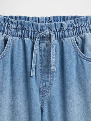 Jeans holgados tipo bolsa de papel sin cierres de talle alto para niños.