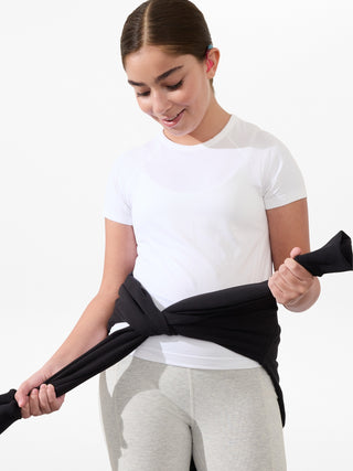 Camiseta larga deportiva Power Up para niña Athleta.