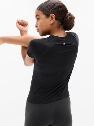 Camiseta larga deportiva Power Up para niña Athleta.