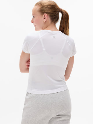 Camiseta larga deportiva Power Up para niña Athleta.