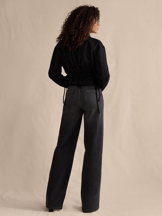 Jeans Acampanado Talle Alto con Bolsillos