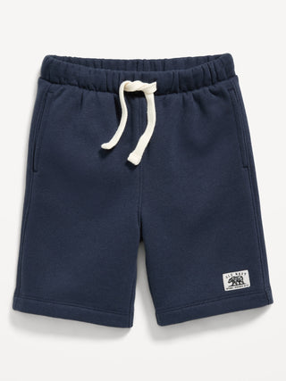 Shorts deportivos de polar con logo gráfico para niños pequeños.