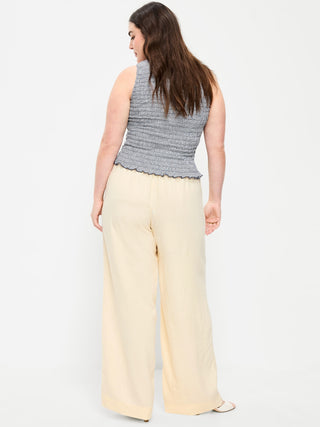 Pantalones súper anchos en mezcla de lino y talle alto.