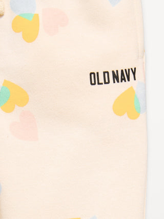 Pantalones deportivos tipo jogger con logo estampado para niñas pequeñas.