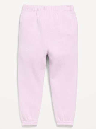 Pantalones deportivos estilo jogger con logo gráfico para niñas pequeñas.