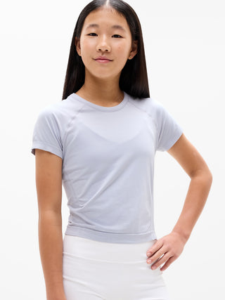 Camiseta larga deportiva Power Up para niña Athleta.