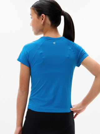 Camiseta larga deportiva Power Up para niña Athleta.