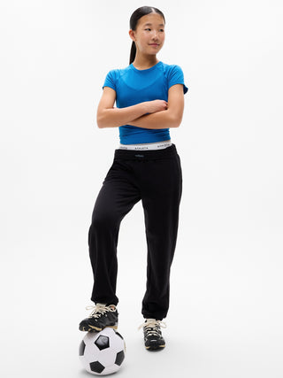 Camiseta larga deportiva Power Up para niña Athleta.