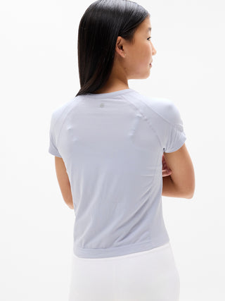 Camiseta larga deportiva Power Up para niña Athleta.