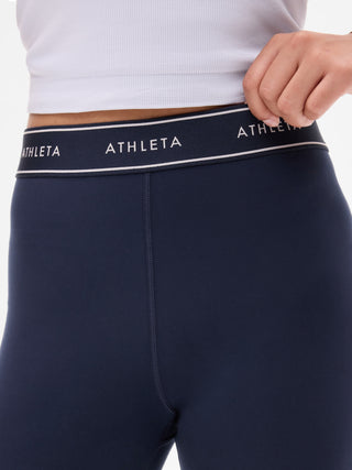 Legging de talle alto para niña Athleta con logo Chit Chat.