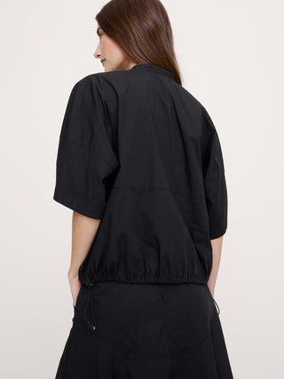 Top de algodón elástico con mangas abullonadas.