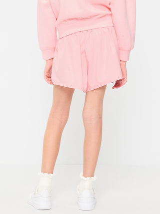 Shorts deportivos StretchTech de cintura alta para niñas.