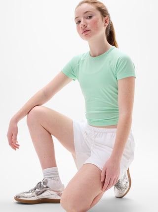 Camiseta larga deportiva Power Up para niña Athleta.