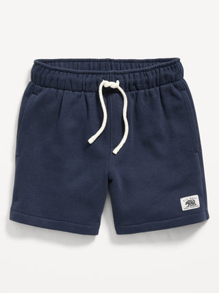 Shorts deportivos de polar con logo y gráfico por encima de la rodilla para niños.