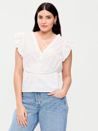 Top bordado con mangas onduladas.