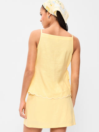 Camiseta sin mangas con delantal y lazo lateral.