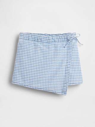 Minifalda-pantalón de mezclilla con frente cruzado de cuadros para niños.