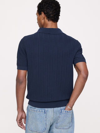 Polo tipo jersey de algodón texturizado a rayas.