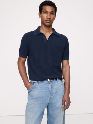Polo tipo jersey de algodón texturizado a rayas.