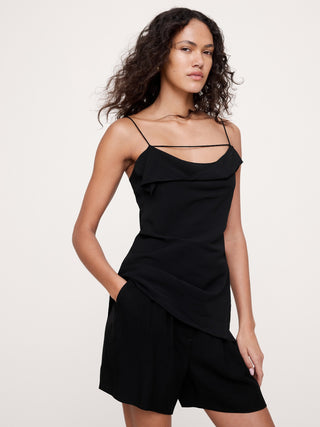 Camiseta sin mangas de georgette con cuello vuelto.