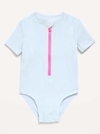 Traje de baño de una pieza con protección frontal texturizada y cremallera para niñas pequeñas.