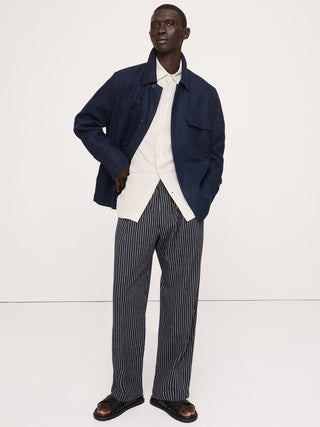 Pantalón relajado sin cierres plisado de lino y algodón.