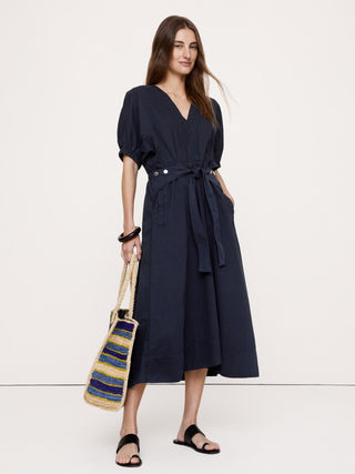 Vestido midi de sarga de algodón con mangas abullonadas.