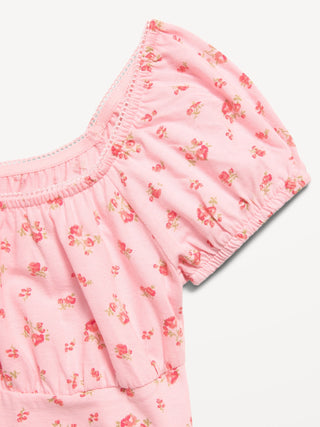 Vestido estampado entallado y con vuelo para niñas.