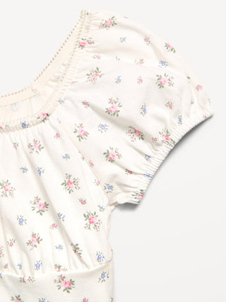 Vestido estampado entallado y con vuelo para niñas.