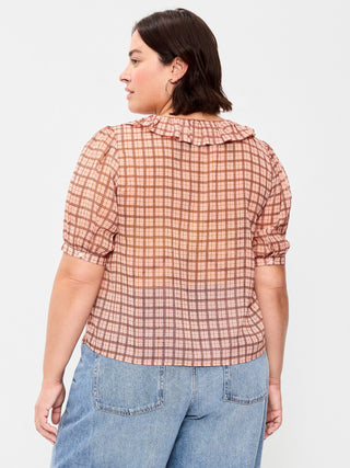 Blusa de gasa con cuello con volantes y lazo en el frente.