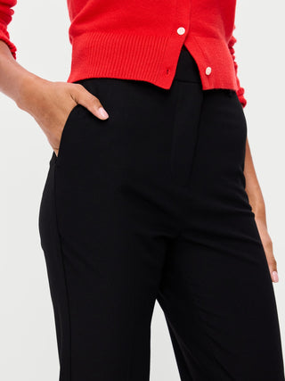 Pantalones de sarga de talle extra alto y pierna recta.